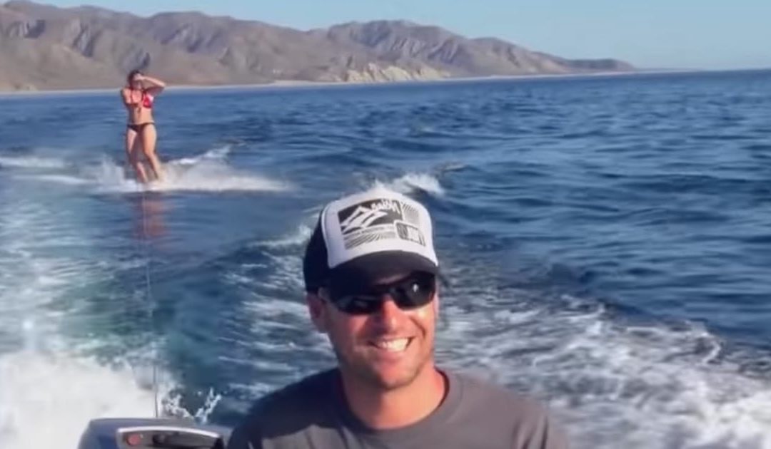Woman Wakeboards With The Most Amazing Surprise Visitors